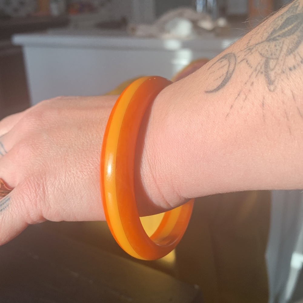 Rare orange with yellow inlay Bakelite bangle.
